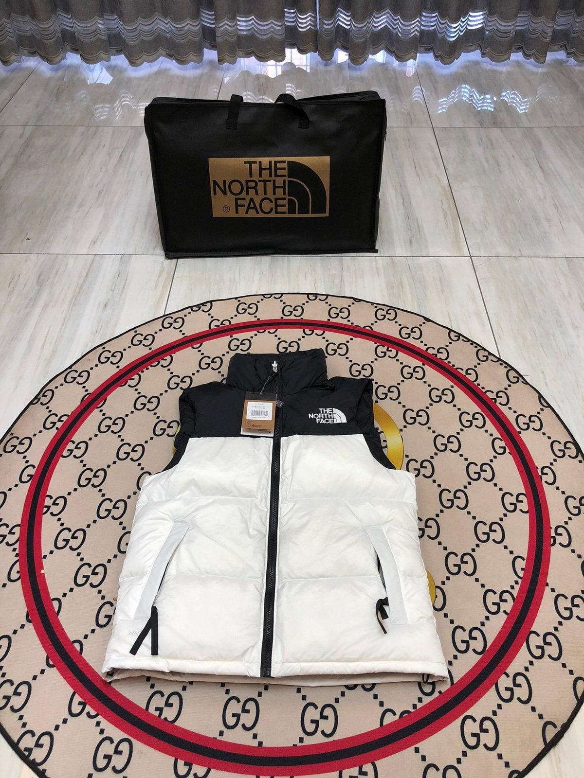 The North Face Puffer Vest in White and Black with Stand Collar